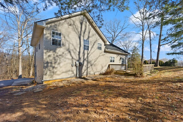 view of side of property featuring a deck