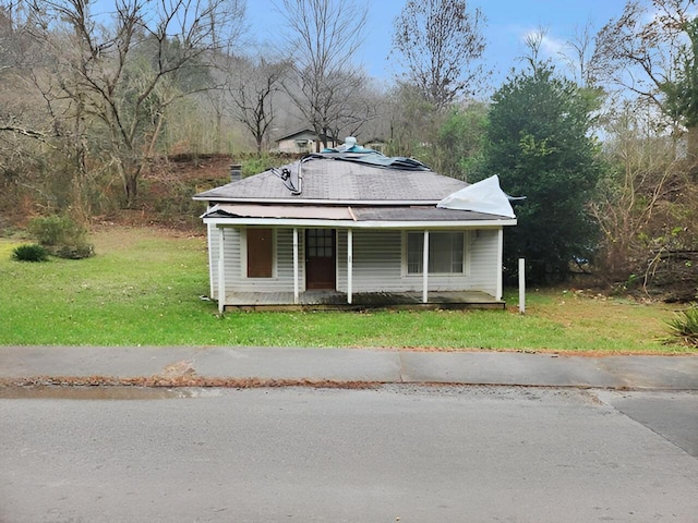 bungalow-style home with a porch and a front yard