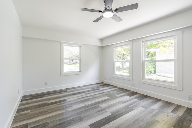 spare room featuring hardwood / wood-style flooring and ceiling fan