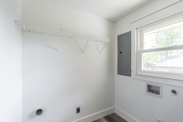 washroom featuring dark hardwood / wood-style flooring, washer hookup, hookup for an electric dryer, and electric panel