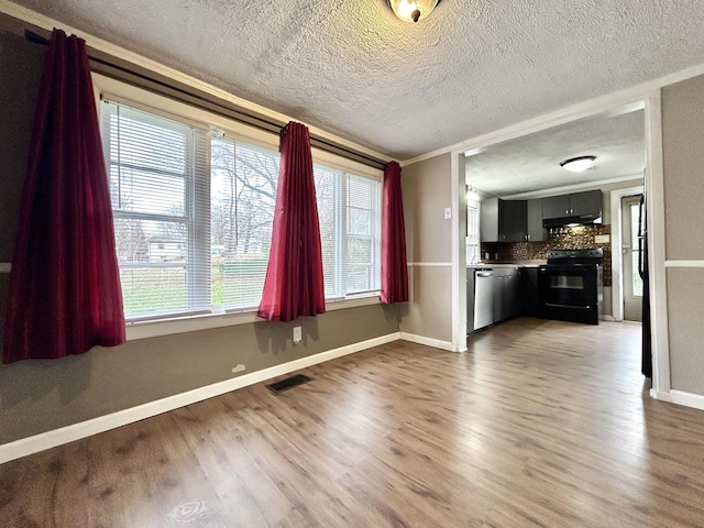 interior space with crown molding, dark hardwood / wood-style flooring, and a textured ceiling