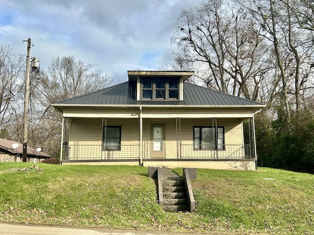 bungalow with a porch and a front lawn