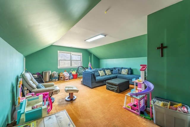 recreation room featuring vaulted ceiling and carpet flooring