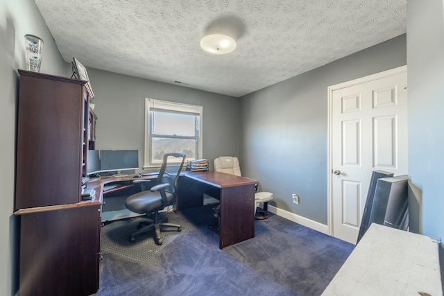 office area with dark carpet and a textured ceiling