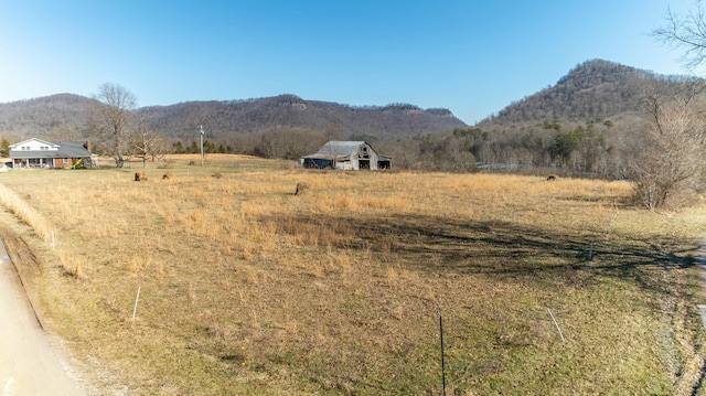 property view of mountains featuring a rural view