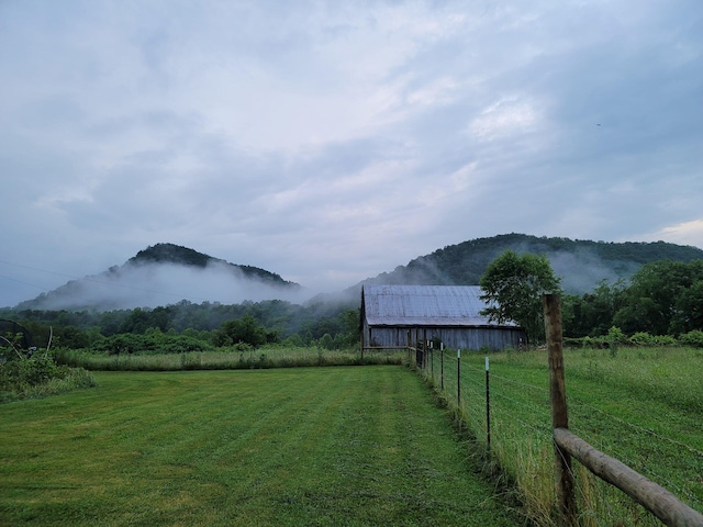 property view of mountains featuring a rural view