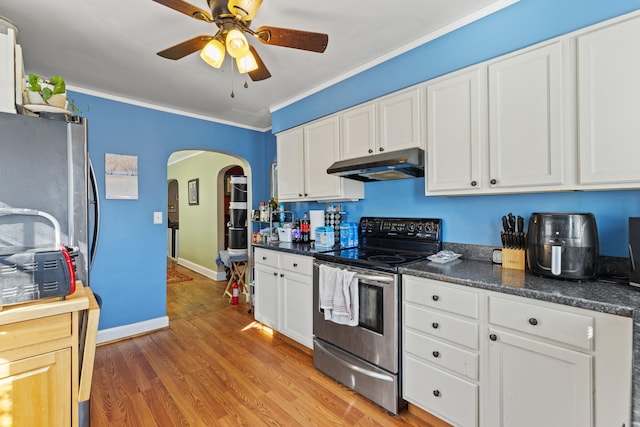 kitchen featuring ornamental molding, white cabinets, light wood-type flooring, and stainless steel electric range