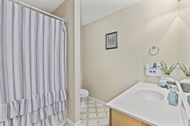 bathroom with vanity, toilet, and a shower with shower curtain