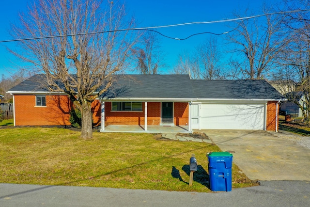 ranch-style home with a garage, a front yard, and a porch