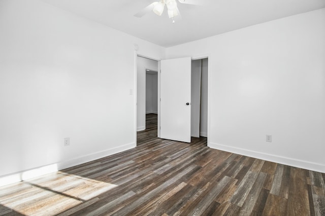 unfurnished room with dark wood-type flooring and ceiling fan