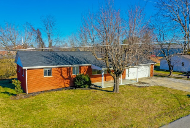 single story home with a garage and a front lawn