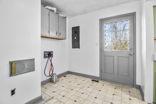 laundry area with cabinets, washer hookup, and electric panel