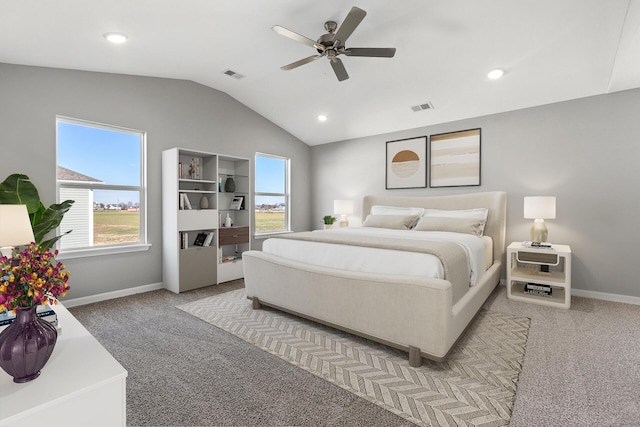 carpeted bedroom with vaulted ceiling and ceiling fan