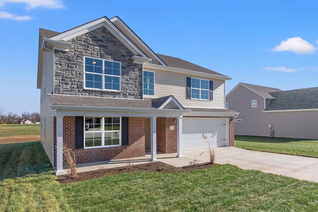 view of front of property featuring a garage and a front lawn