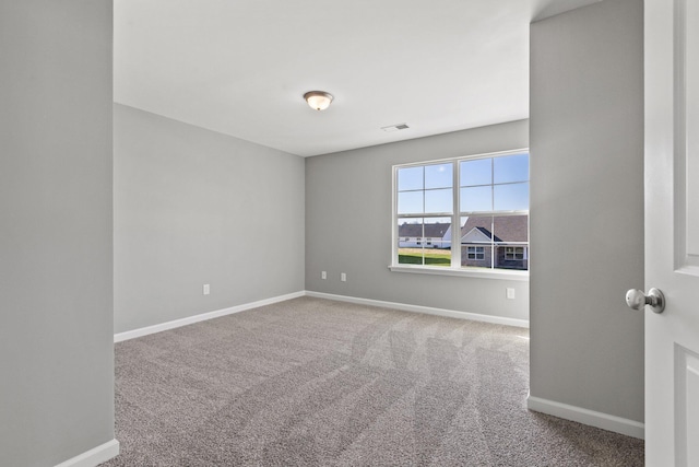 unfurnished room with carpet flooring