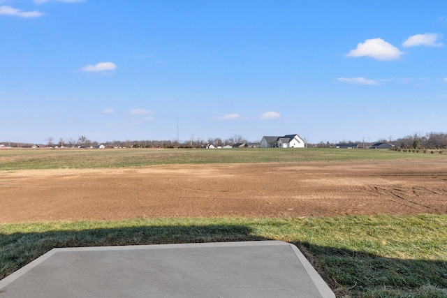 view of yard with a rural view