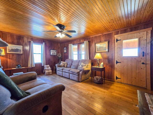 living room with wooden ceiling, ceiling fan, and light wood-type flooring