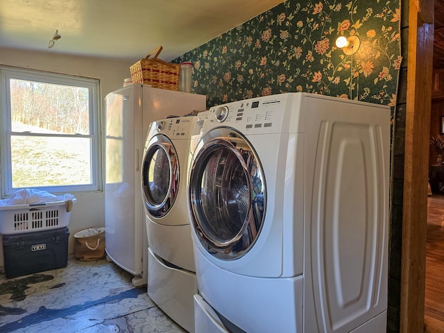 clothes washing area featuring washing machine and dryer