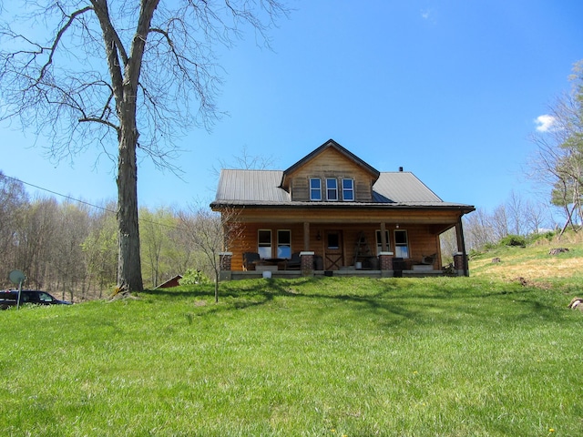 back of house with a porch and a lawn