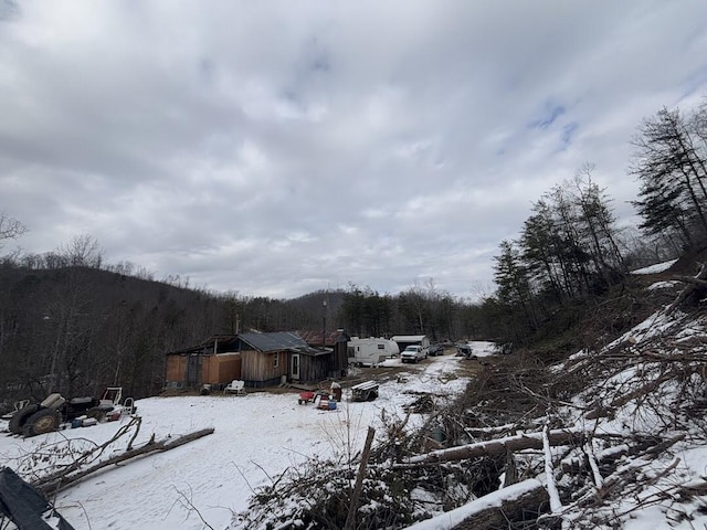 view of yard layered in snow