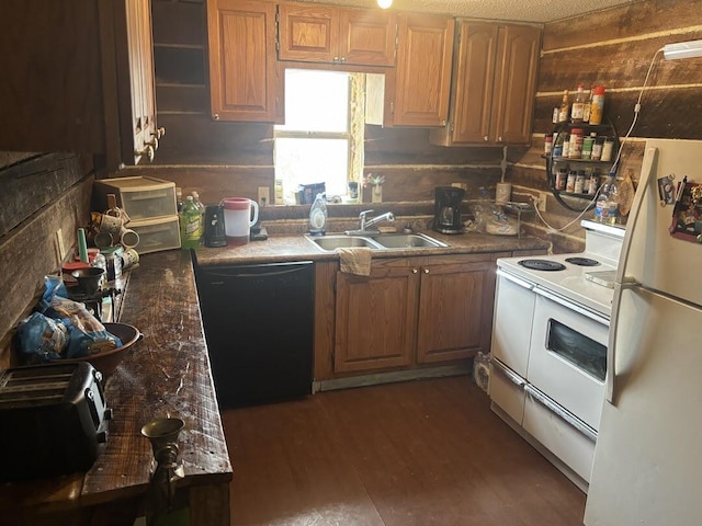 kitchen featuring white appliances, dark hardwood / wood-style flooring, and sink