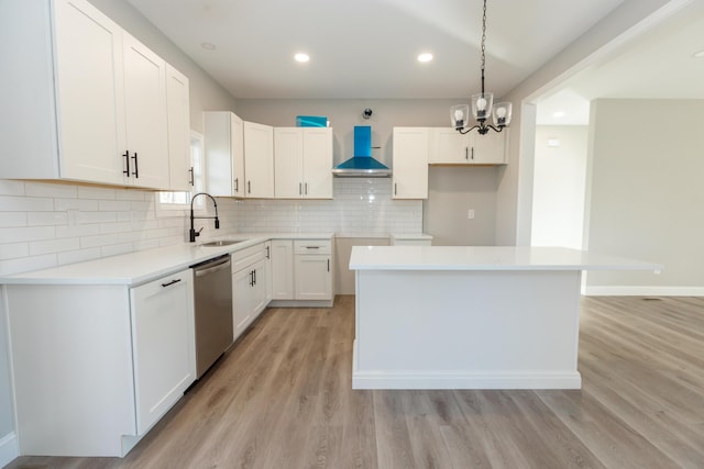 kitchen with sink, a center island, white cabinets, stainless steel dishwasher, and wall chimney exhaust hood