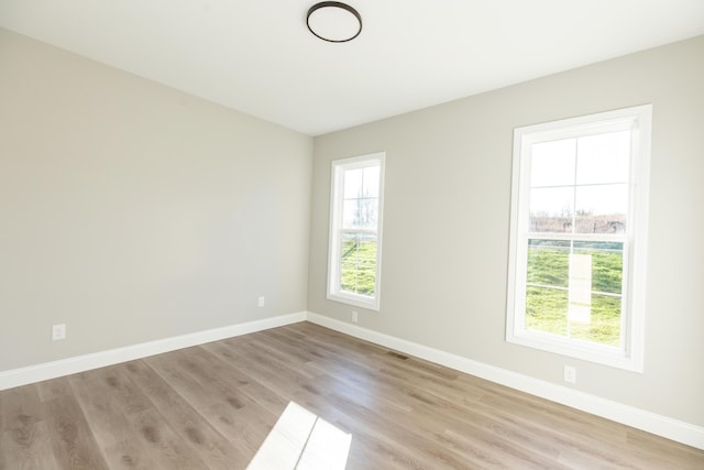 empty room with light wood-type flooring