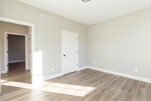 empty room featuring light hardwood / wood-style floors