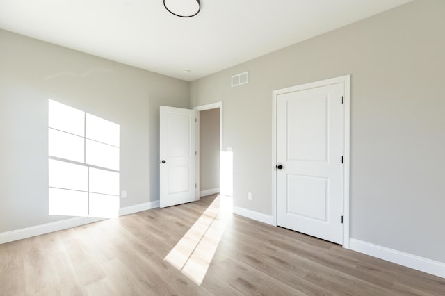 unfurnished bedroom featuring light hardwood / wood-style flooring