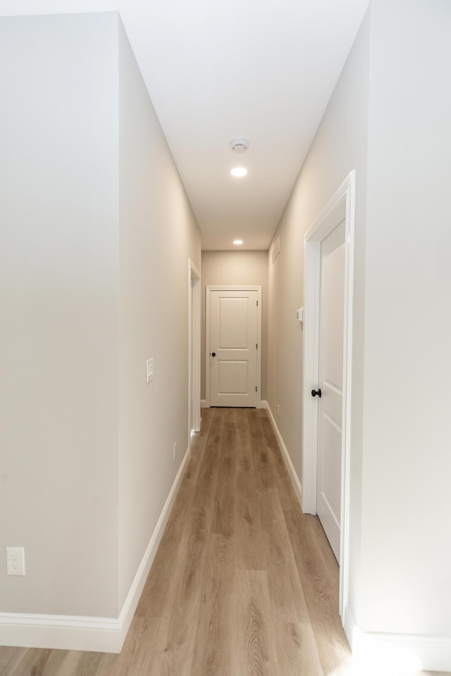 corridor featuring light hardwood / wood-style floors