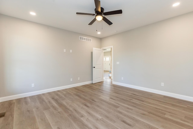 spare room with ceiling fan and light hardwood / wood-style floors