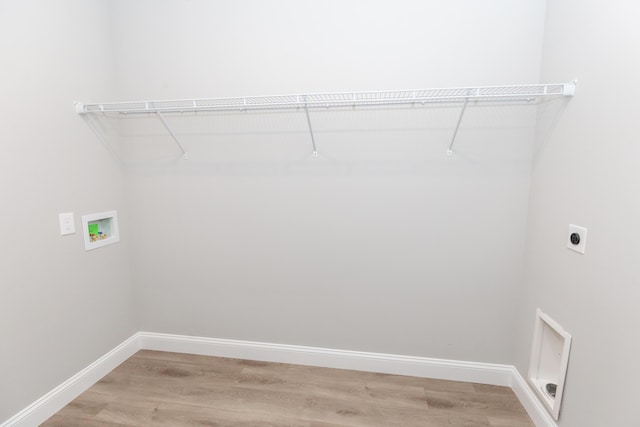 clothes washing area featuring washer hookup, wood-type flooring, and electric dryer hookup