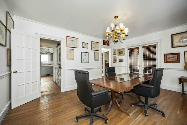 office featuring crown molding, baseboards, dark wood finished floors, and a notable chandelier