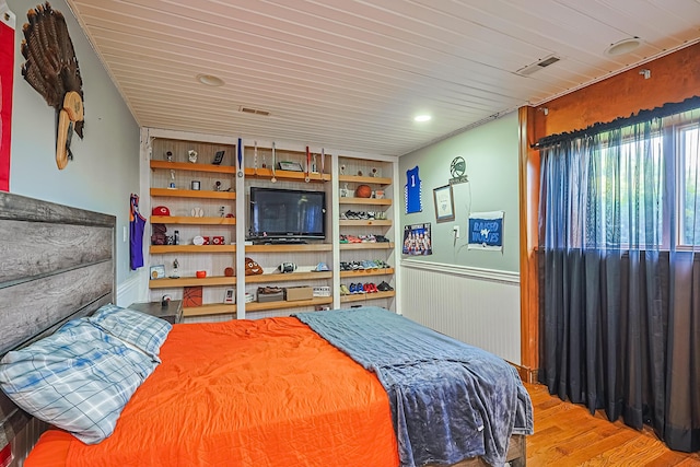 bedroom featuring wood ceiling and light hardwood / wood-style flooring