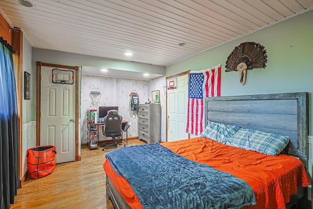 bedroom featuring hardwood / wood-style floors and wooden ceiling