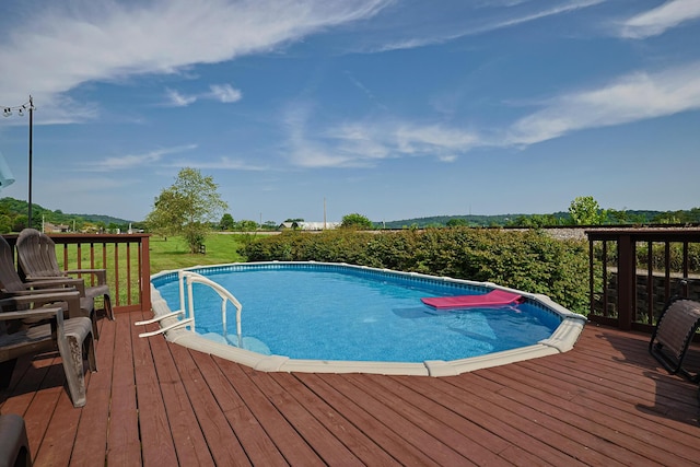 view of pool with a deck