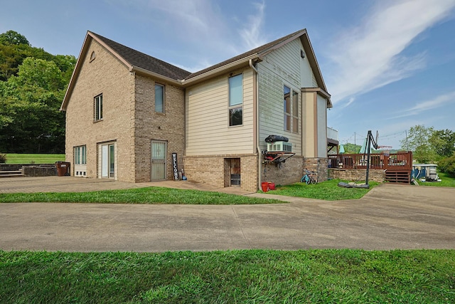 back of property with a wooden deck