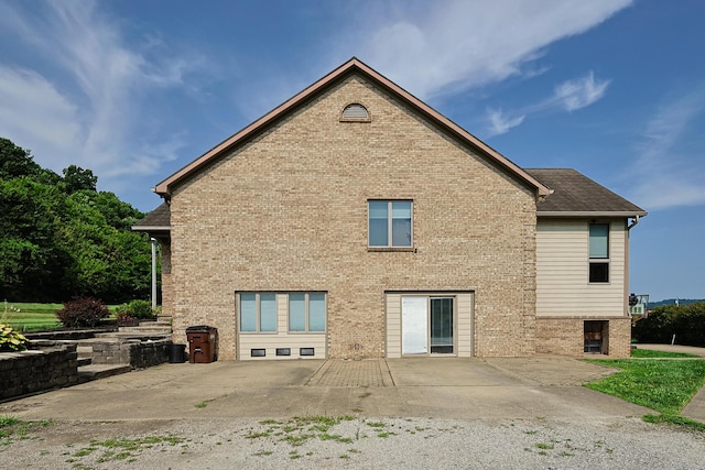 rear view of property featuring a patio area