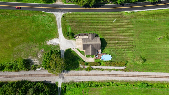 birds eye view of property with a rural view