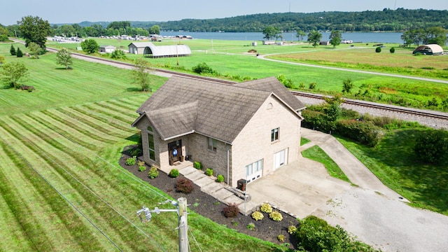 drone / aerial view featuring a water view and a rural view