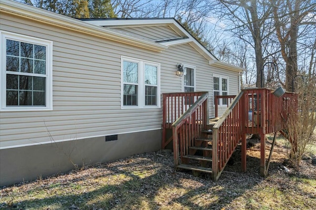 entrance to property with a deck