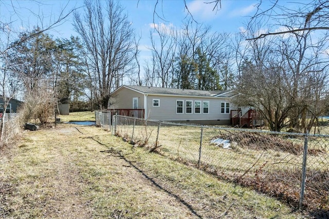 back of house with a lawn