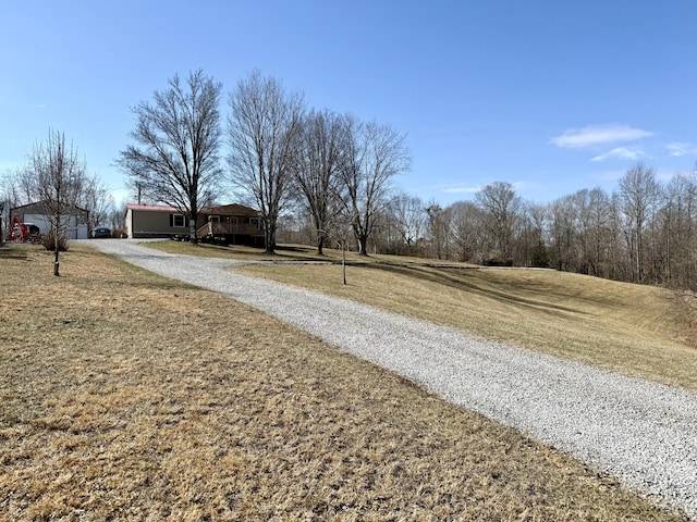 view of street featuring gravel driveway