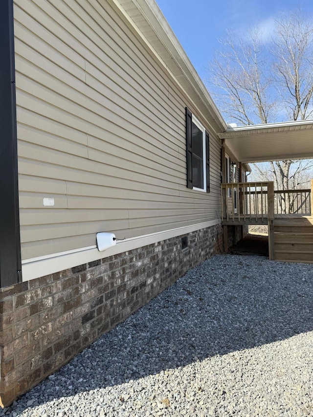 view of home's exterior with crawl space and a deck