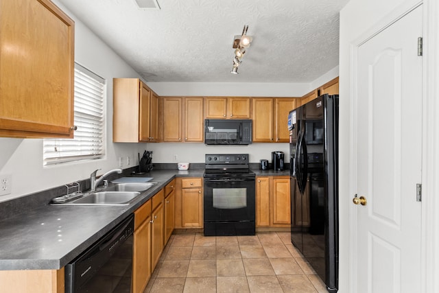 kitchen featuring light tile patterned floors, sink, a textured ceiling, and black appliances