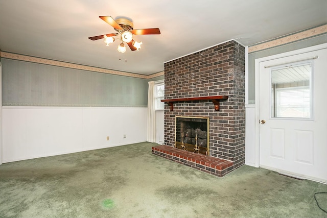 unfurnished living room featuring plenty of natural light, carpet floors, and a fireplace