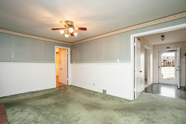 carpeted empty room with ceiling fan