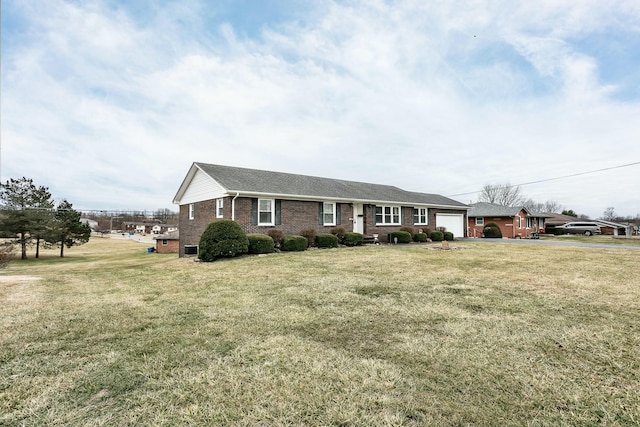 view of front of house with a garage and a front yard