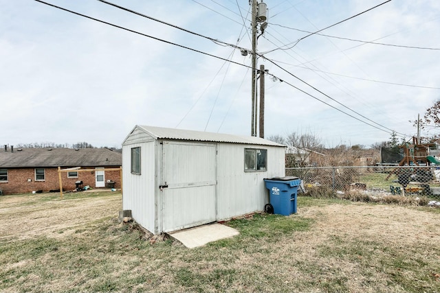 view of outdoor structure featuring a yard and a playground