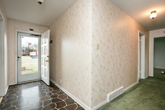 interior space with dark colored carpet